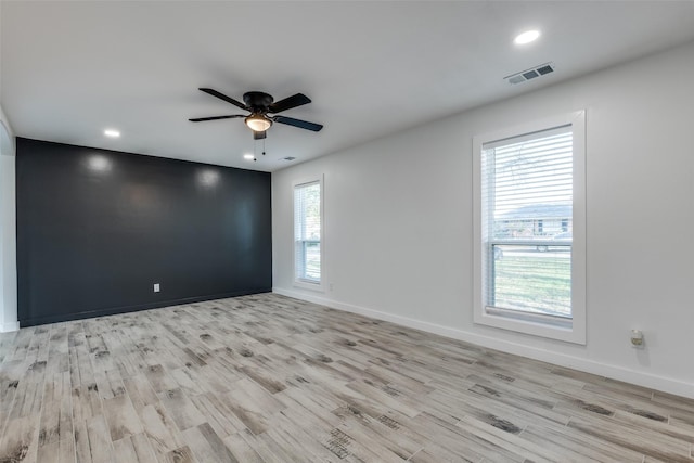 unfurnished room featuring light hardwood / wood-style floors and ceiling fan