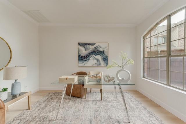 office area with ornamental molding, visible vents, baseboards, and wood finished floors