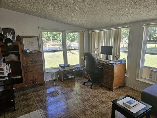 office with lofted ceiling and a textured ceiling