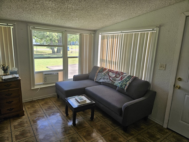 living room with lofted ceiling and a textured ceiling