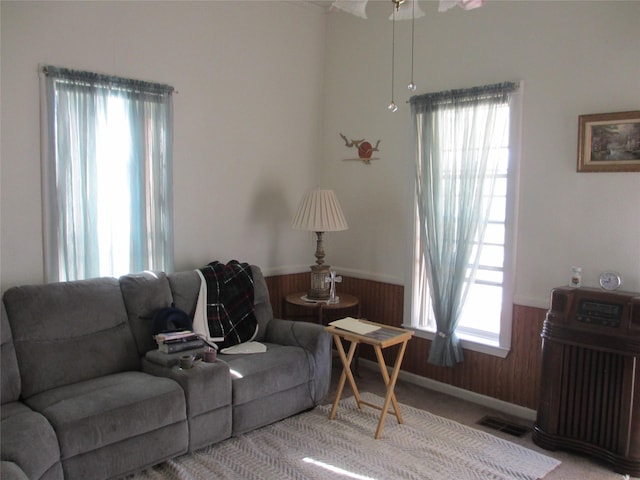 living room with wooden walls