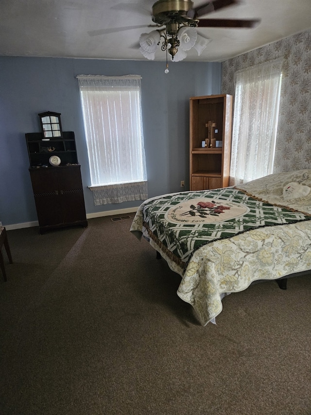 bedroom with ceiling fan and carpet flooring