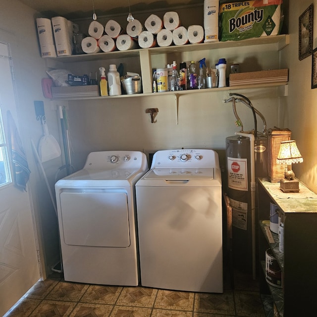 washroom with electric water heater and washing machine and clothes dryer