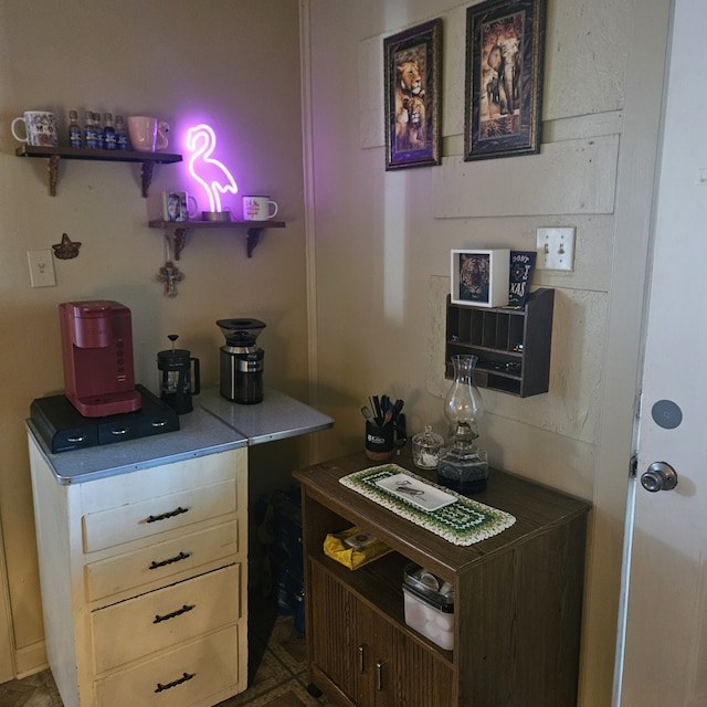 bar featuring dark brown cabinets and cream cabinetry