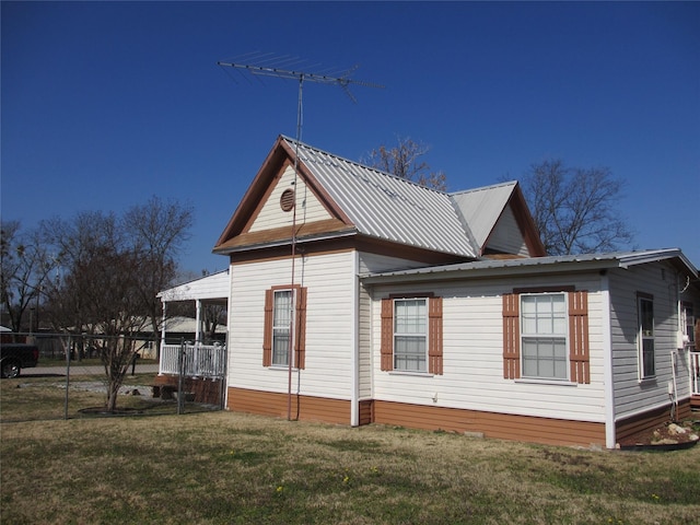 view of home's exterior featuring a yard