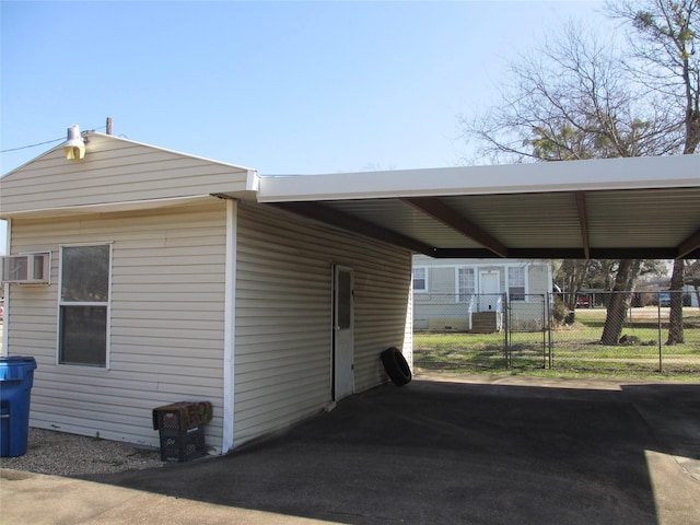 view of parking / parking lot with a carport