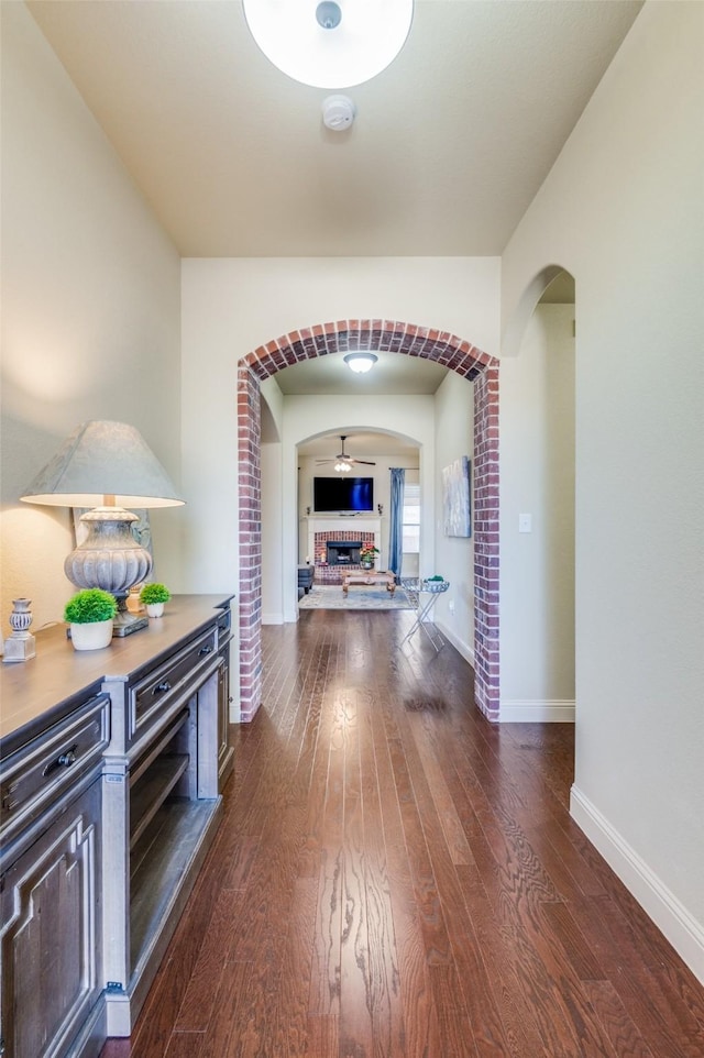 hallway with dark wood-type flooring