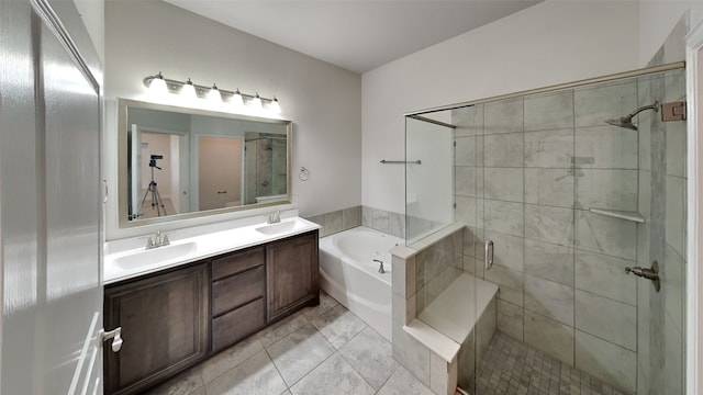 bathroom with tile patterned floors, vanity, and independent shower and bath