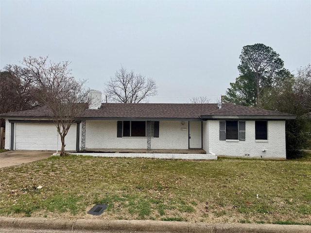 single story home featuring a garage and a front lawn