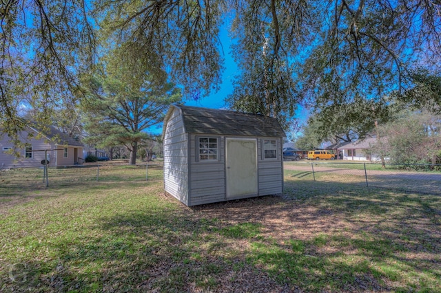 view of outbuilding with a lawn