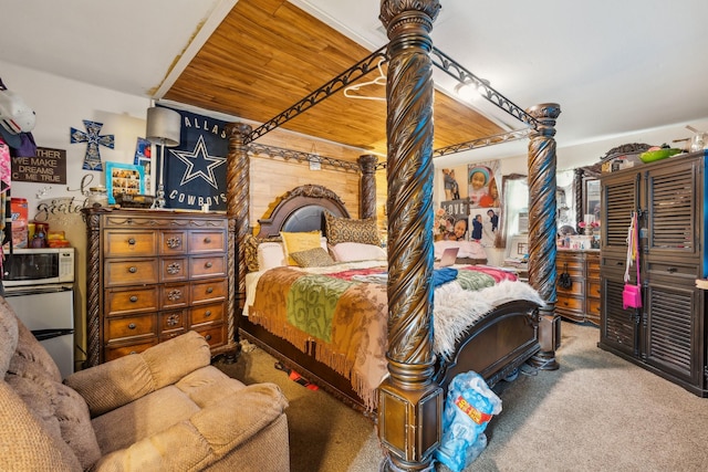 carpeted bedroom featuring wood ceiling