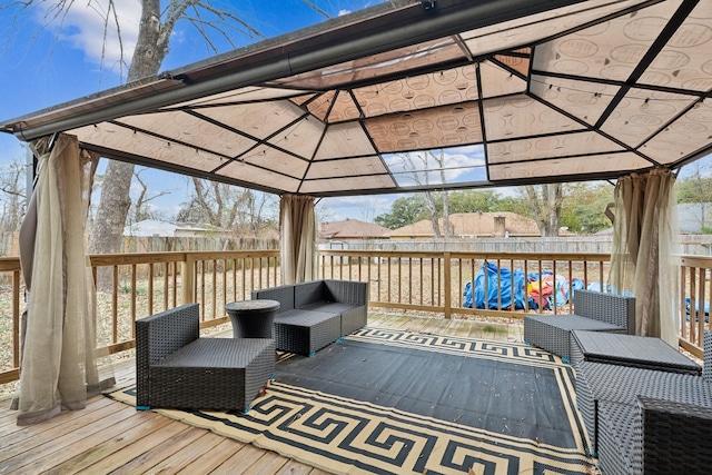 wooden deck with a gazebo and an outdoor hangout area