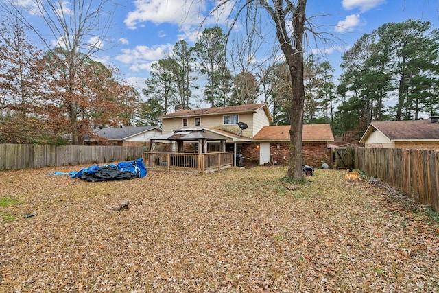 back of house featuring a gazebo