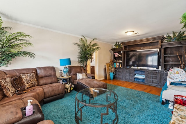 living room featuring crown molding and hardwood / wood-style floors