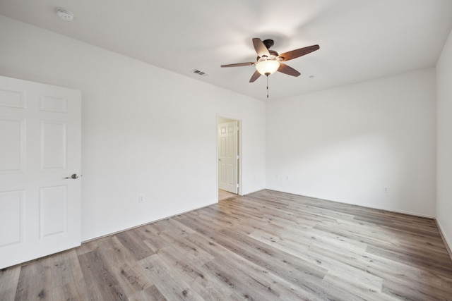 unfurnished room with ceiling fan and light hardwood / wood-style flooring