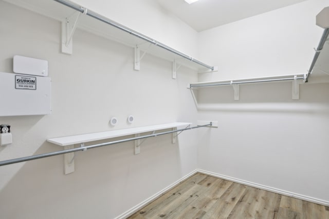 walk in closet featuring light wood-type flooring