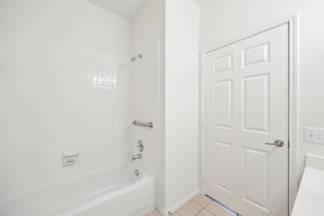 bathroom with tile patterned flooring, vanity, and tiled shower / bath combo