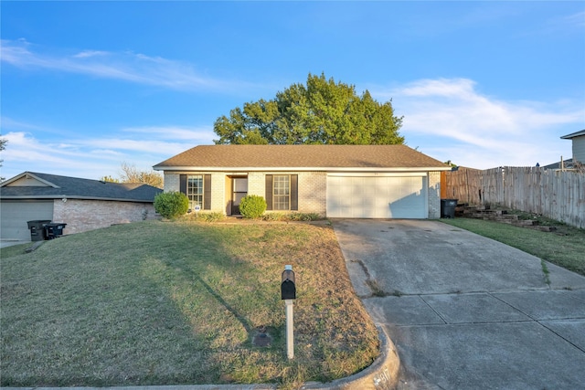 ranch-style home with a garage and a front yard