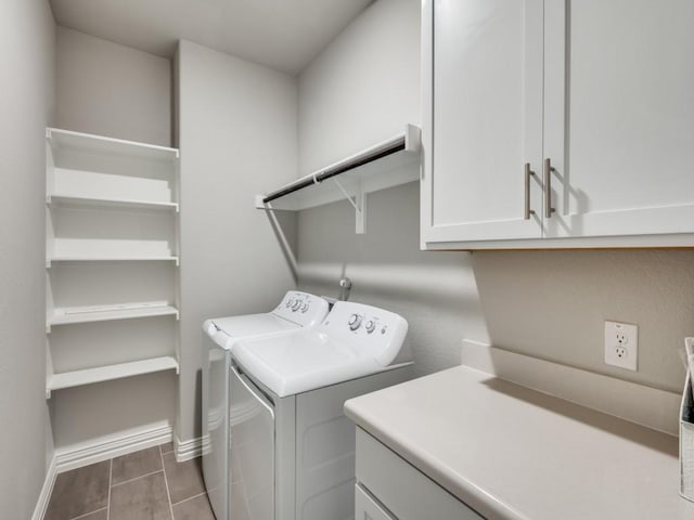 laundry room with washer and dryer, cabinet space, and baseboards