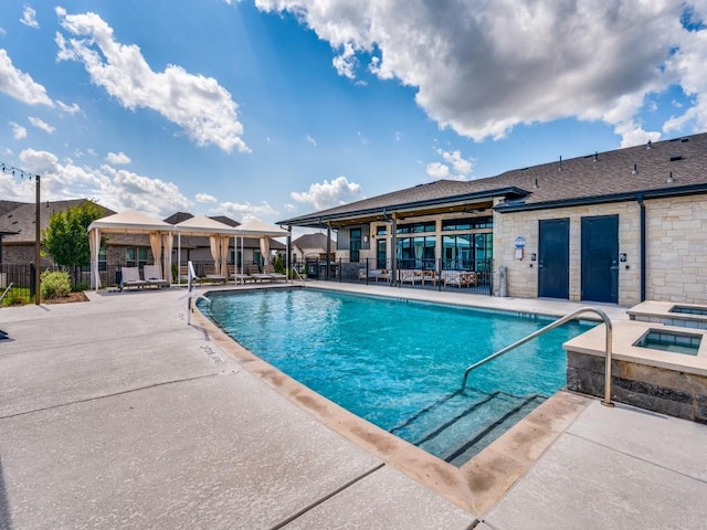 view of swimming pool featuring a gazebo and a patio area