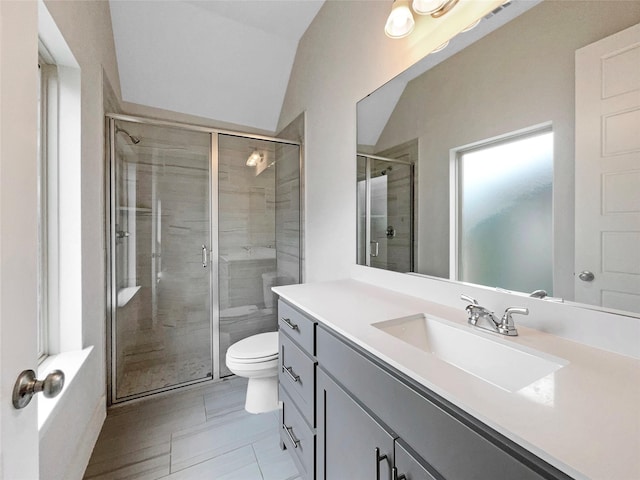 bathroom with lofted ceiling, toilet, an enclosed shower, and vanity