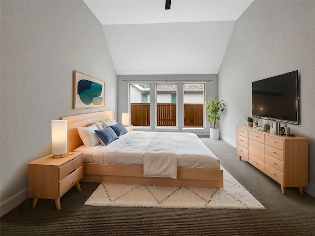 carpeted bedroom featuring vaulted ceiling