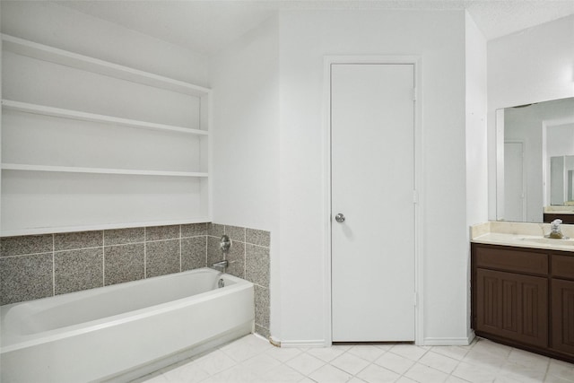 bathroom featuring vanity and a washtub