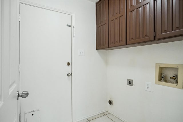 washroom with cabinets, light tile patterned floors, hookup for a washing machine, and electric dryer hookup