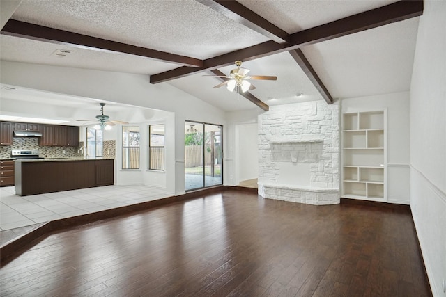 unfurnished living room with vaulted ceiling with beams, light hardwood / wood-style floors, a textured ceiling, and ceiling fan