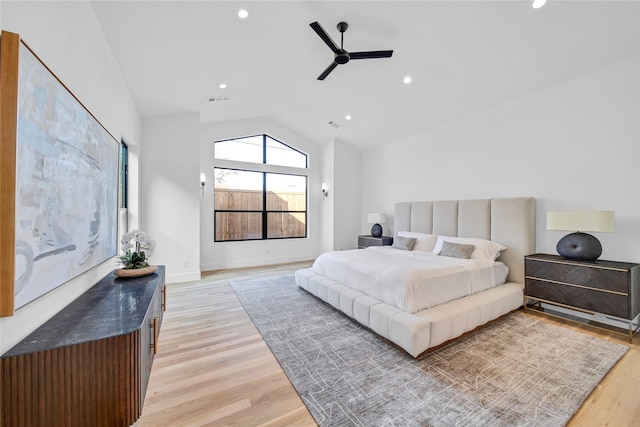 bedroom featuring vaulted ceiling, ceiling fan, and light hardwood / wood-style floors