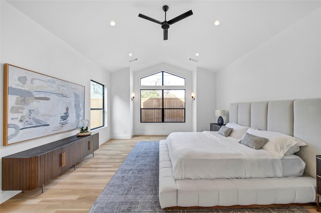 bedroom featuring vaulted ceiling, light wood-style flooring, a ceiling fan, and visible vents