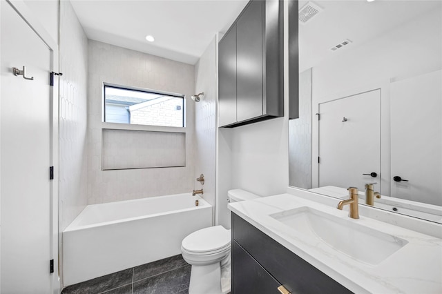 full bathroom featuring tiled shower / bath, vanity, and toilet