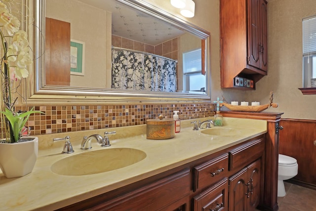 bathroom featuring vanity, tile patterned floors, and toilet