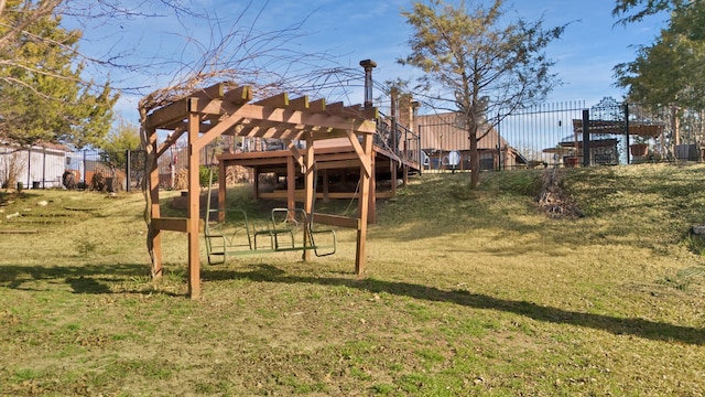 view of playground with a lawn