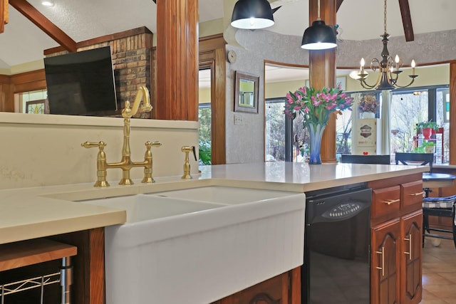 kitchen featuring sink, hanging light fixtures, black dishwasher, a notable chandelier, and tile patterned floors