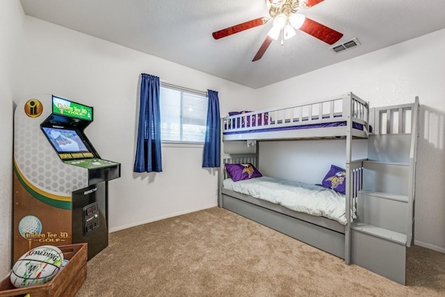 bedroom featuring light colored carpet, visible vents, ceiling fan, and baseboards