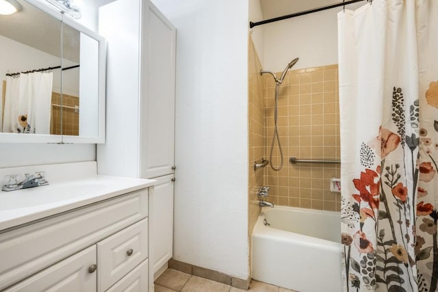 bathroom featuring shower / bath combination with curtain, vanity, baseboards, and tile patterned floors