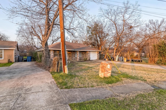 view of front of property with a garage and a front lawn