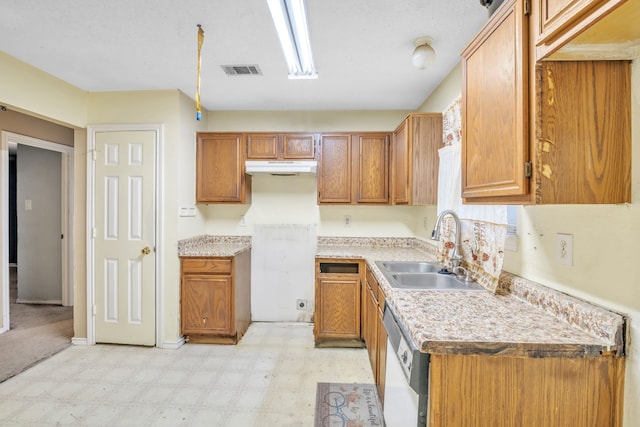 kitchen featuring dishwasher and sink