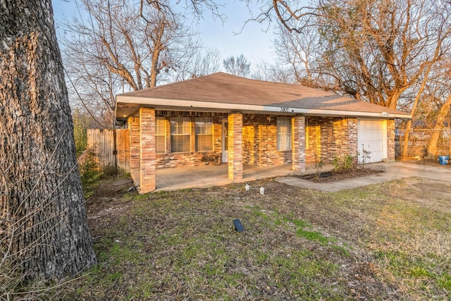 back of property featuring a garage