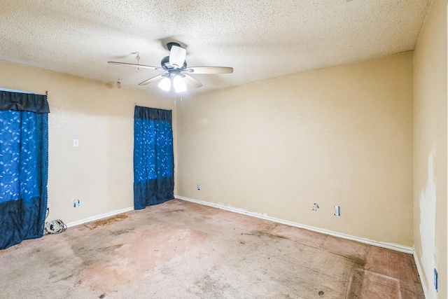 empty room featuring ceiling fan, carpet floors, and a textured ceiling