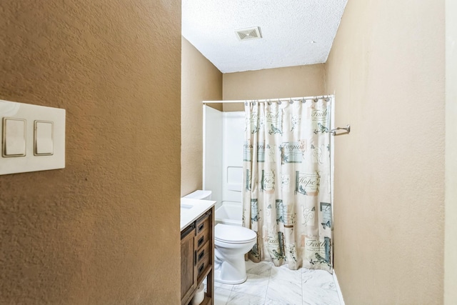 full bathroom with vanity, shower / tub combo, a textured ceiling, and toilet