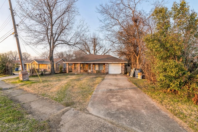 view of front of home with a garage and a front yard