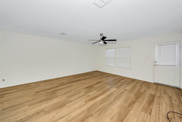 empty room featuring ceiling fan and light hardwood / wood-style flooring