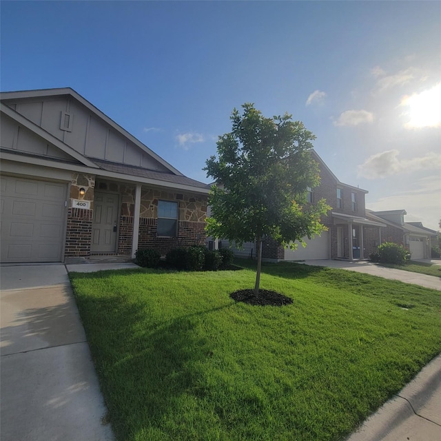 400 Frio Pass Trl, Fort Worth, TX 76052 - view of front of property with concrete driveway, a front lawn, board and batten siding, a porch, and brick siding