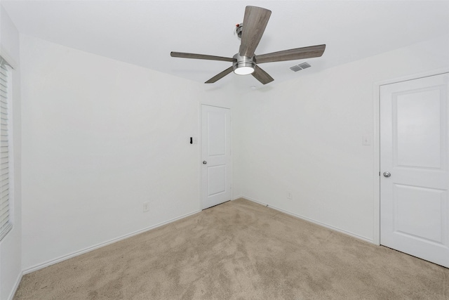 carpeted empty room with ceiling fan