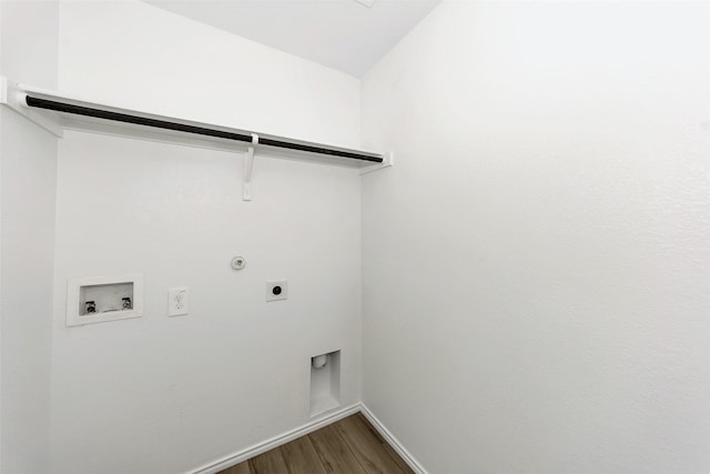 clothes washing area featuring gas dryer hookup, hardwood / wood-style floors, hookup for a washing machine, and hookup for an electric dryer