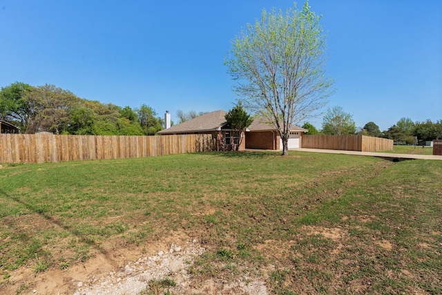 view of yard with a garage