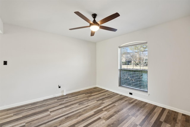 empty room with ceiling fan and wood-type flooring