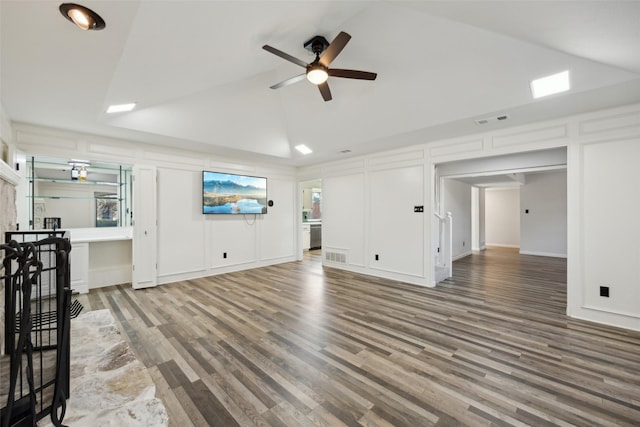 unfurnished living room with ceiling fan, wood-type flooring, and high vaulted ceiling